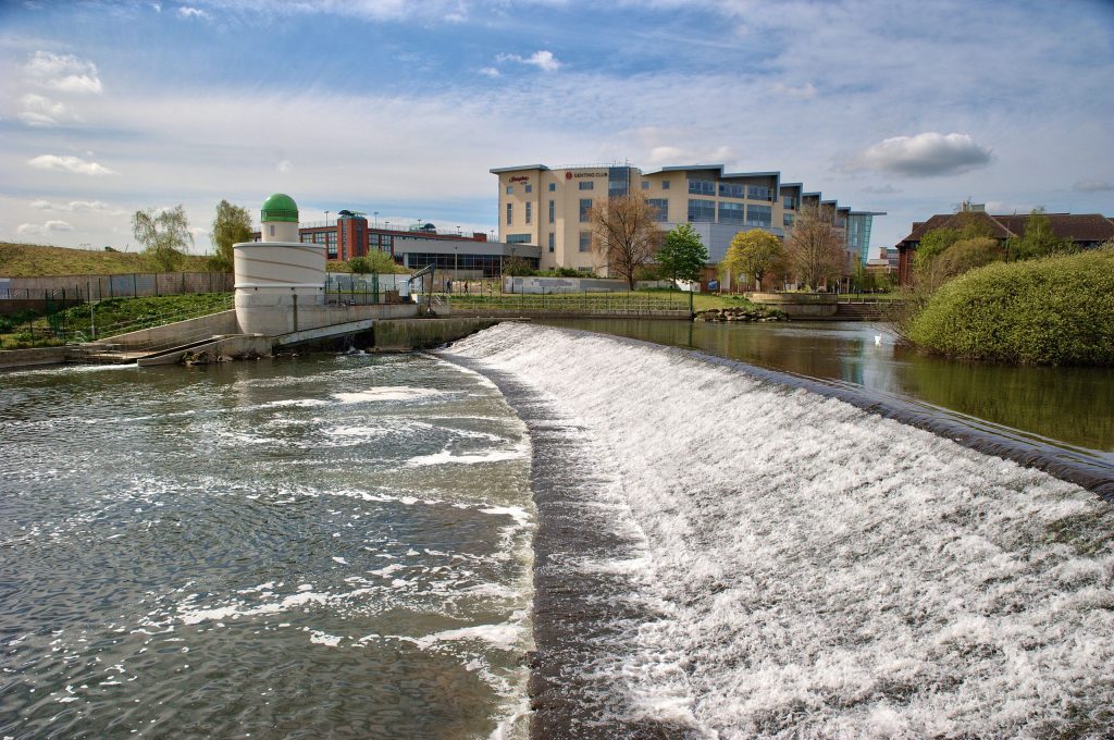 A scenic view of Derby Cathedral or the Derwent River, emphasizing clean and well-maintained surroundings.