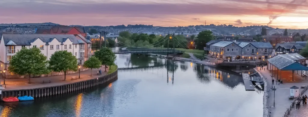 A scenic view of Exeter Cathedral or the Exeter Quayside, highlighting clean and picturesque surroundings.